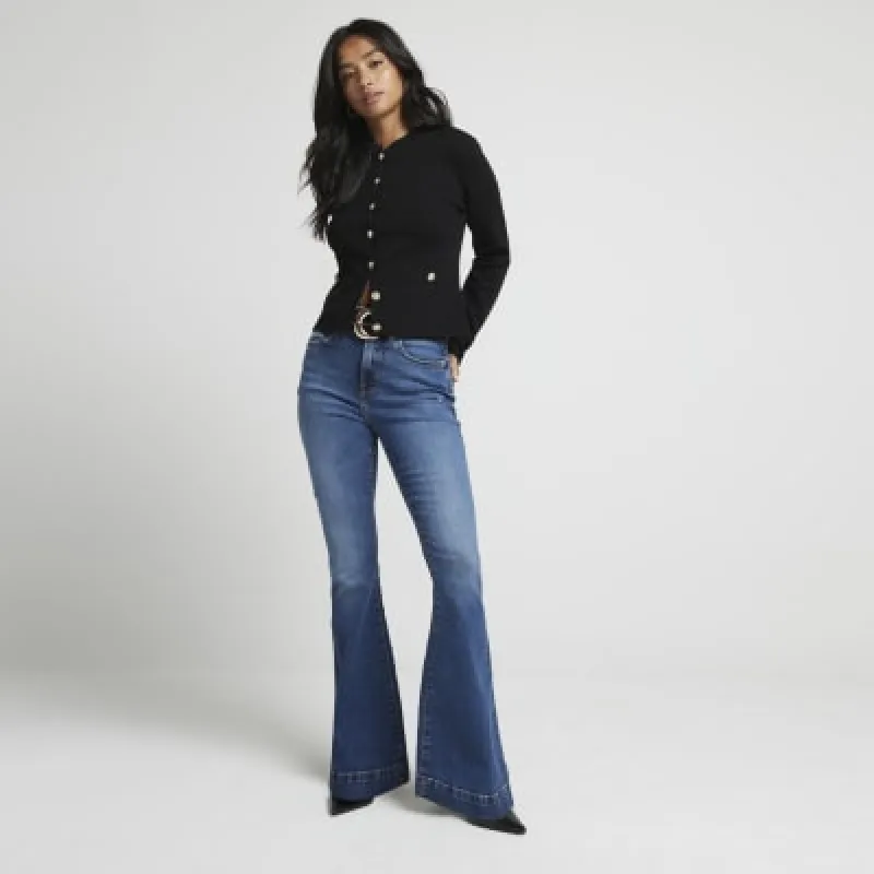 Petite blue mid rise flared jeans made by River Island