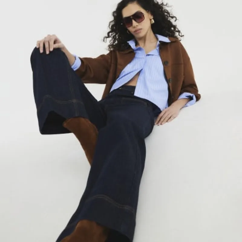 Indigo high waisted wide leg jeans sold by River Island