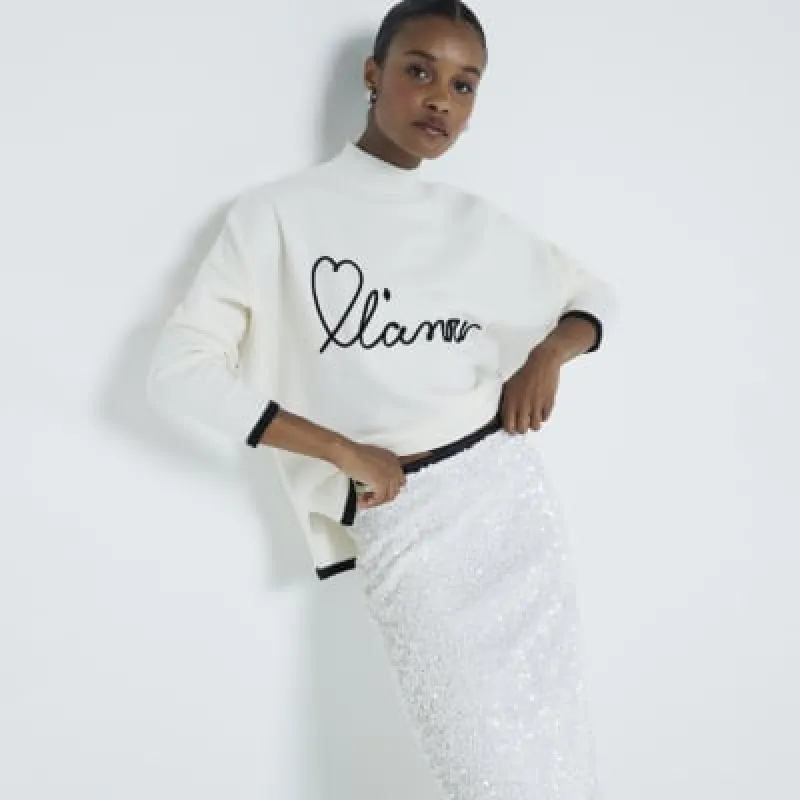 Cream L'Amour Graphic High Neck Jumper sold by River Island