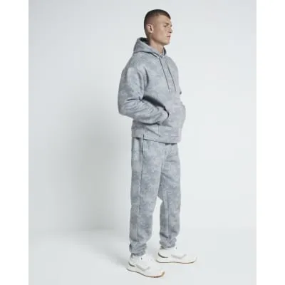 Khaki Relaxed Fit Cuffed Camo Print Joggers sold by River Island