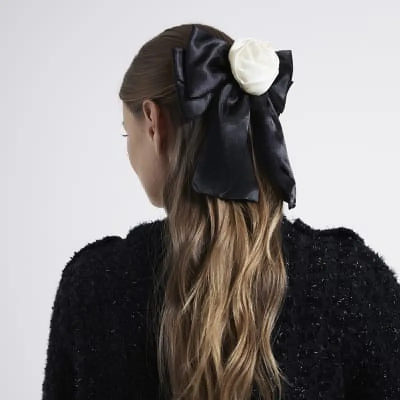 Black Satin Bow Hair Clip sold by River Island