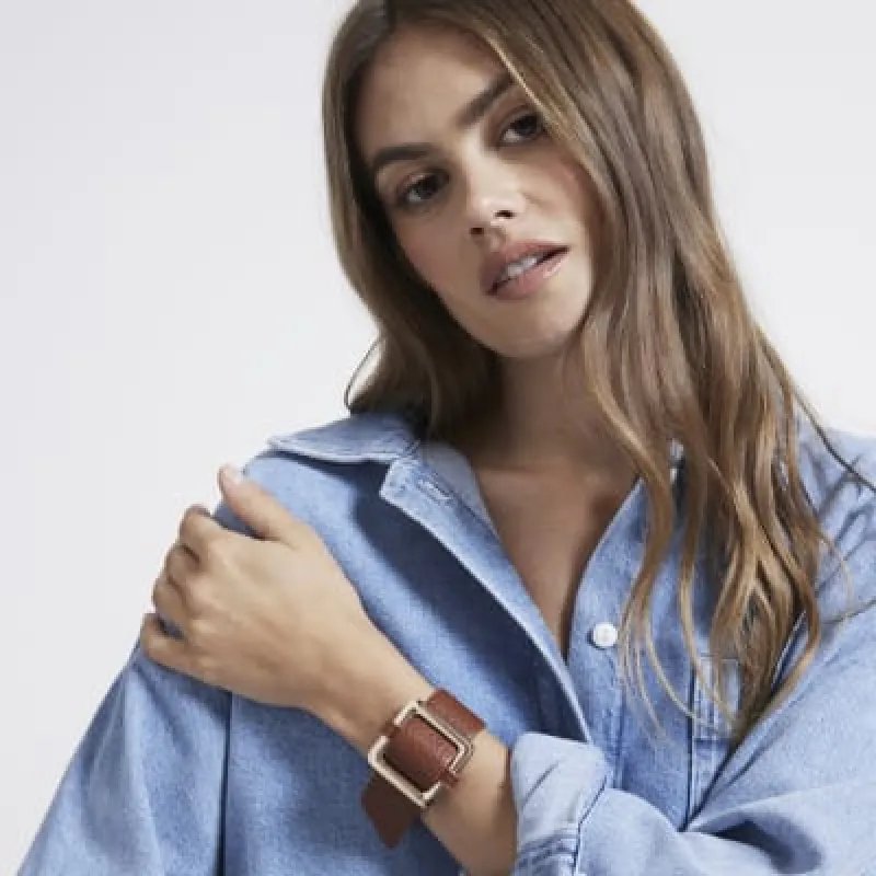 Brown buckle cuff bracelet sold by River Island