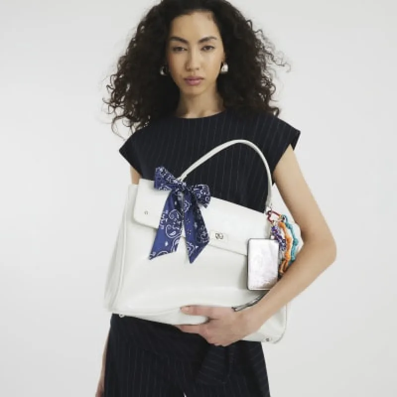 Cream Faux Leather Charm Tote Bag sold by River Island