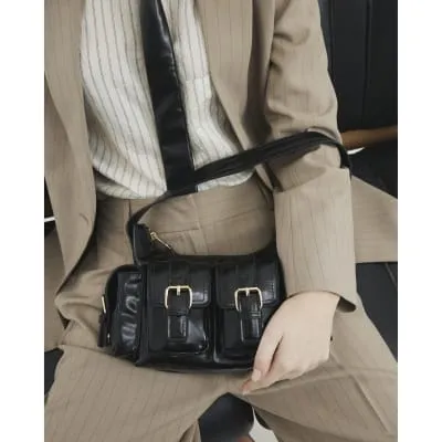 Black Buckle Pocket Utility Shoulder Bag sold by River Island