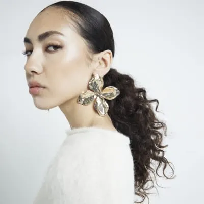 Gold Metal Flower Stud Earrings sold by River Island