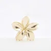 Gold Flower Hair Claw Clip sold by River Island