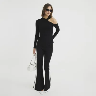 Black Long Sleeve Cut Out Top sold by River Island