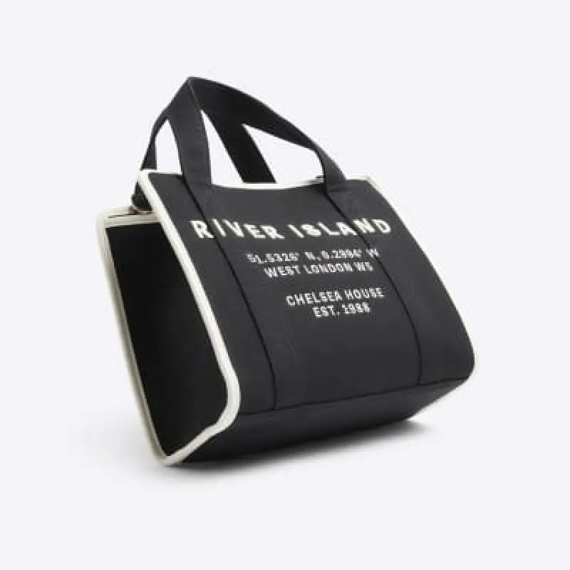 Black canvas embroidered tote bag sold by River Island