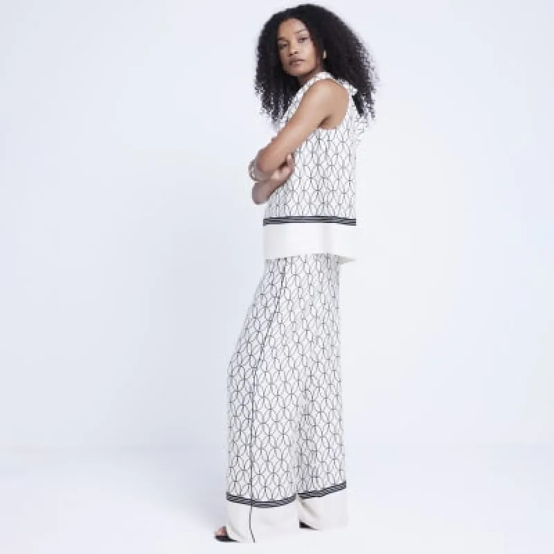 White geometric wide leg trousers sold by River Island