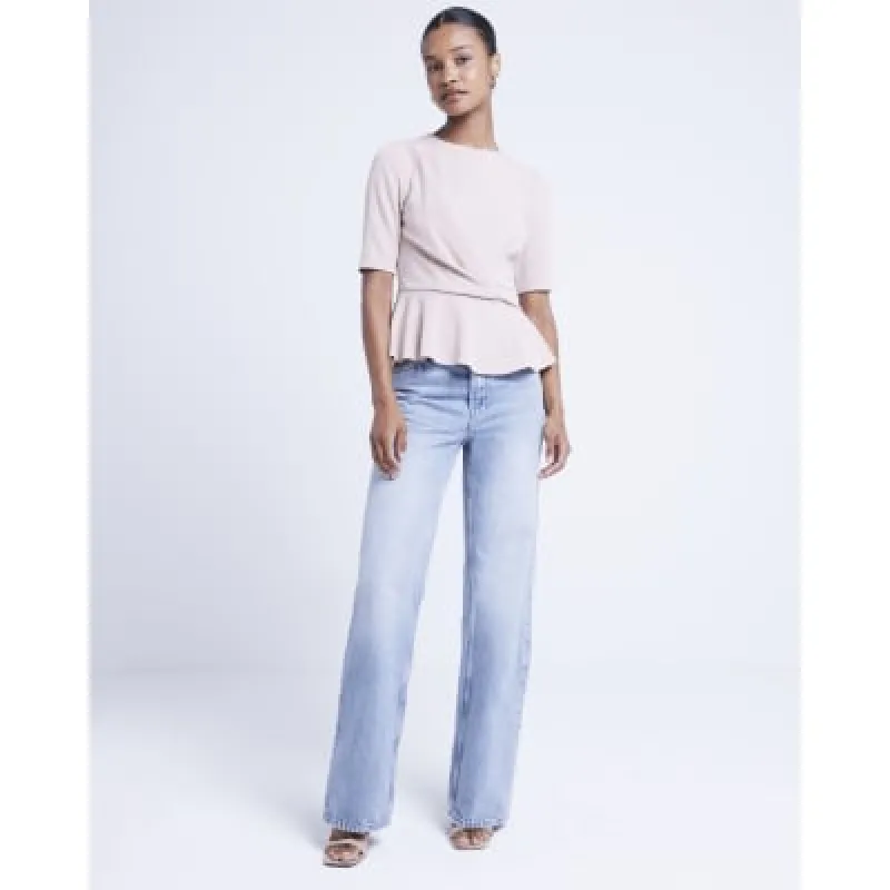 Beige twist front peplum top sold by River Island