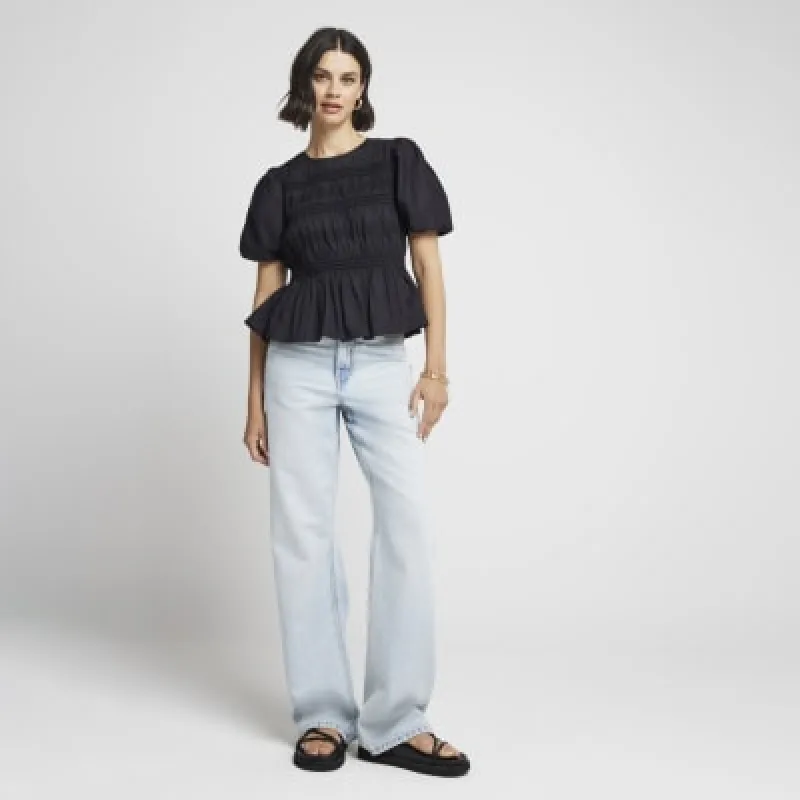 Black ruched puff sleeve blouse sold by River Island