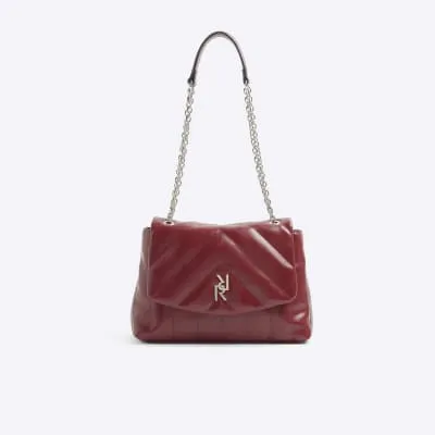 Red quilted chain strap shoulder bag sold by River Island