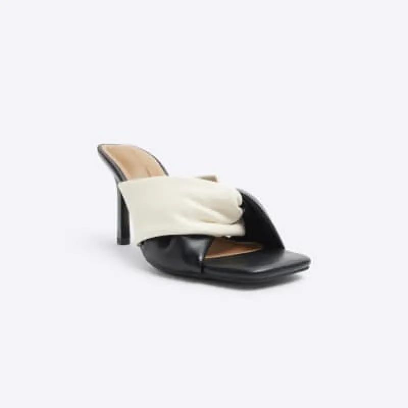 Black twist heeled mule sandals sold by River Island