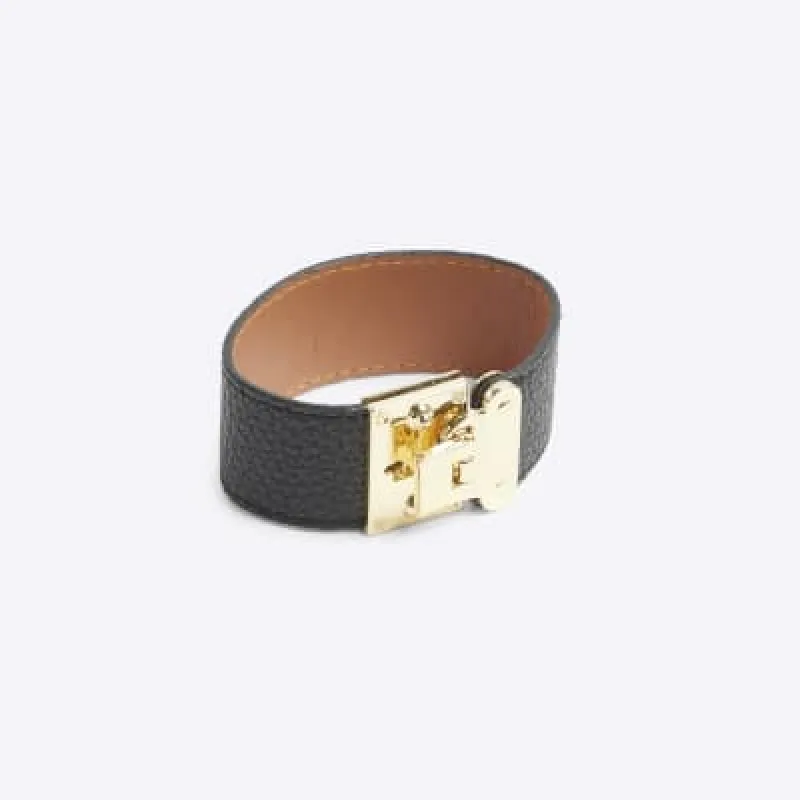 Black lock clasp cuff bracelet sold by River Island