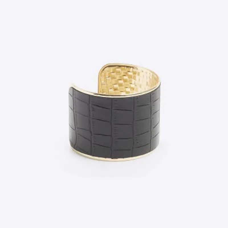 Black croc embossed cuff bracelet sold by River Island