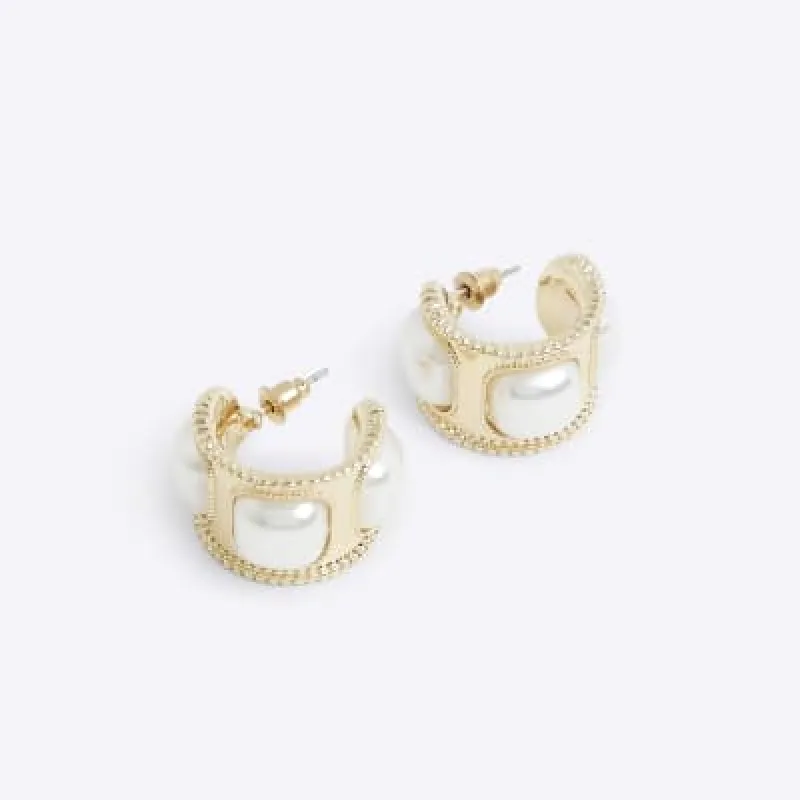 Gold pearl detail mini hoop earrings sold by River Island