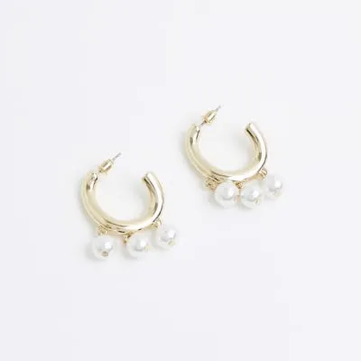 Gold pearl drop hoop earrings sold by River Island