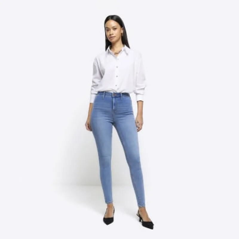 Blue high waisted skinny jeans sold by River Island
