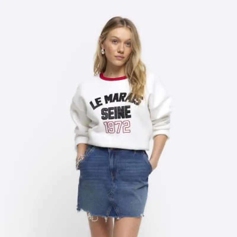 Petite blue asymmetric denim mini skirt sold by River Island