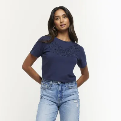 Navy lace cut out t-shirt sold by River Island