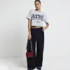 Navy stripe wide leg trousers sold by River Island