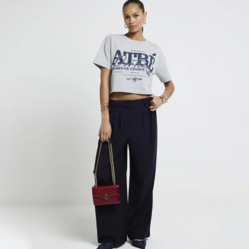 Navy stripe wide leg trousers sold by River Island