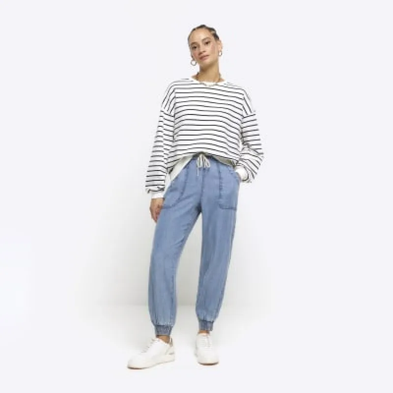 Blue lyocell cuffed joggers sold by River Island