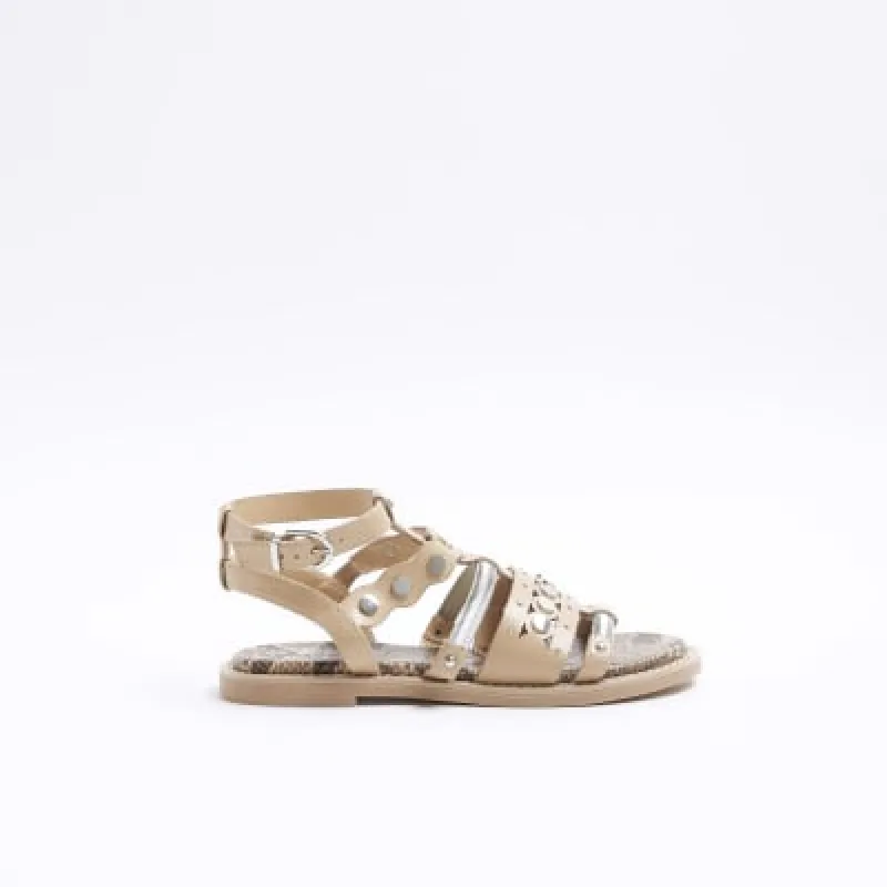 Pink studded gladiator sandals sold by River Island