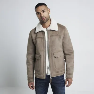 Beige regular fit faux fur shearling jacket sold by River Island