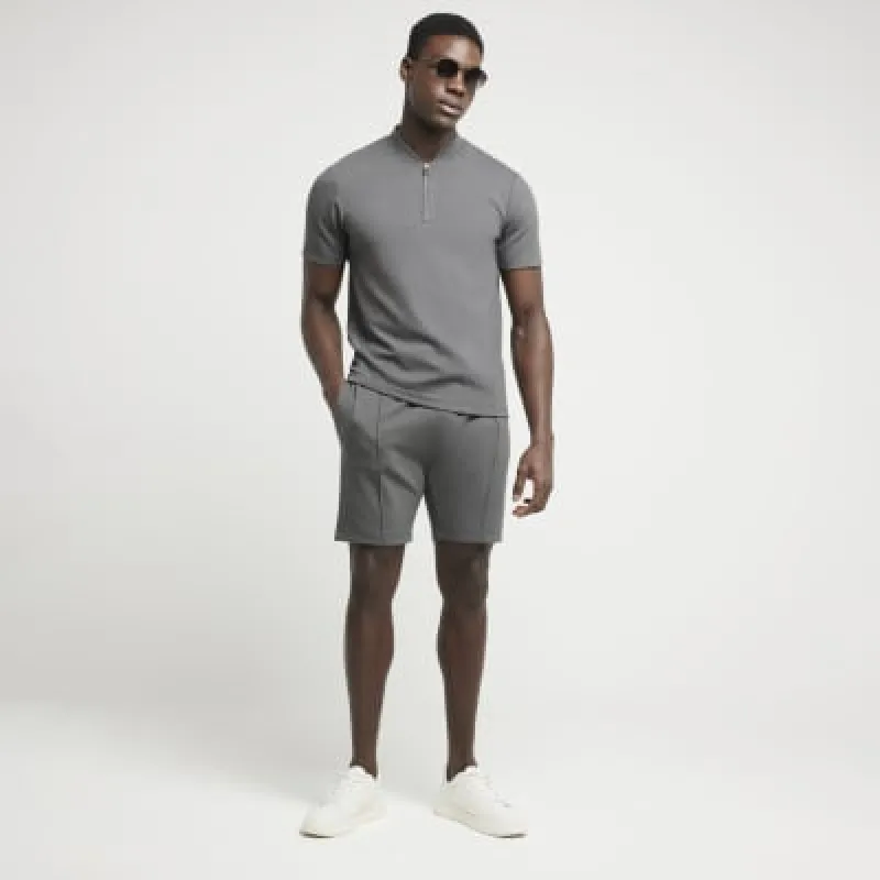 Grey slim fit textured half zip polo sold by River Island