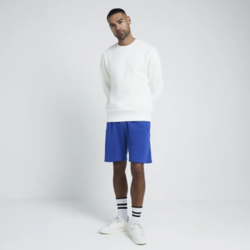 Blue regular fit loopback shorts made by River Island