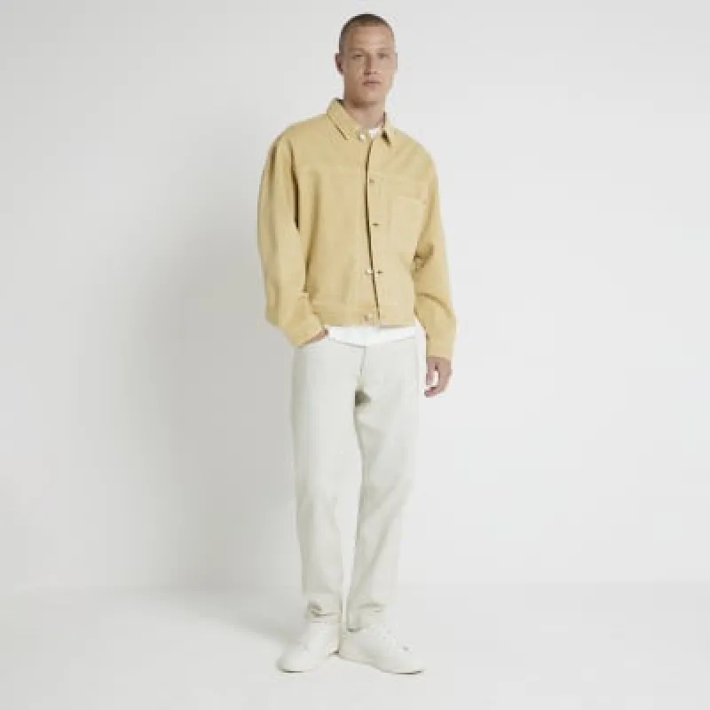 Blue tapered fit bleached jeans sold by River Island