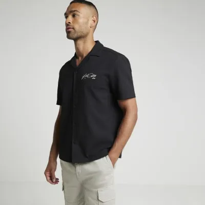 Black regular fit embroidered revere shirt sold by River Island