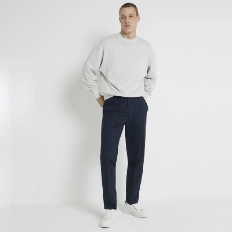 Navy slim fit smart chino trousers sold by River Island