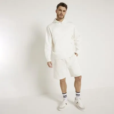 Beige regular fit loopback shorts sold by River Island