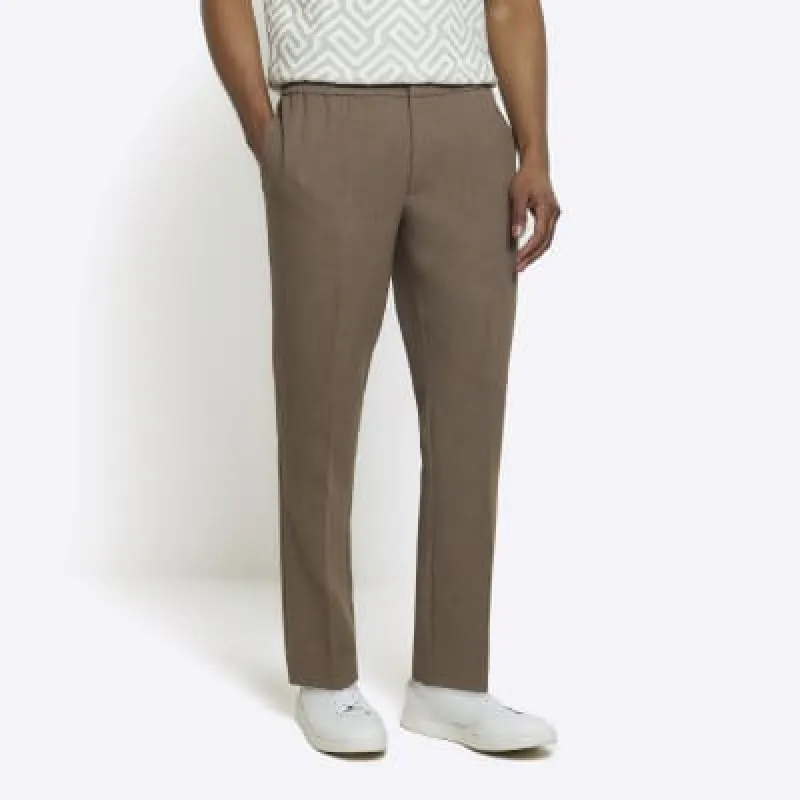 Beige slim fit elasticated smart joggers sold by River Island
