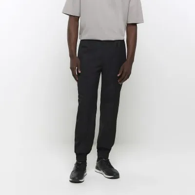 Black slim fit cuffed smart joggers sold by River Island