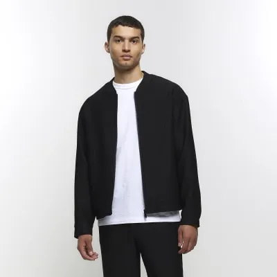 Black regular fit plisse zip bomber jacket sold by River Island