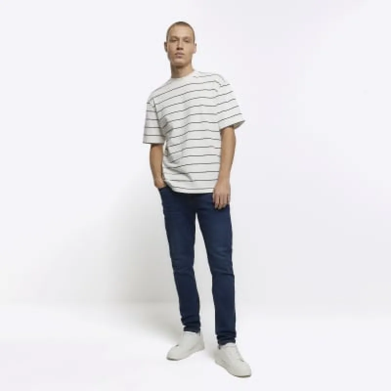 Blue skinny jeans sold by River Island