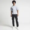 Black regular fit cargo trousers sold by River Island
