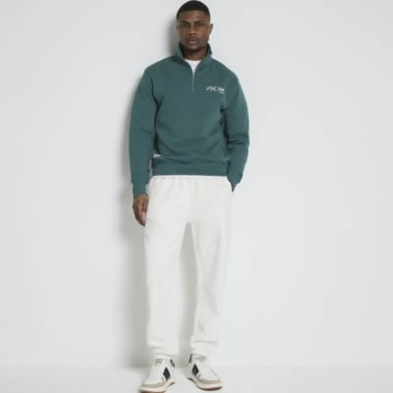 Beige regular fit loopback joggers sold by River Island