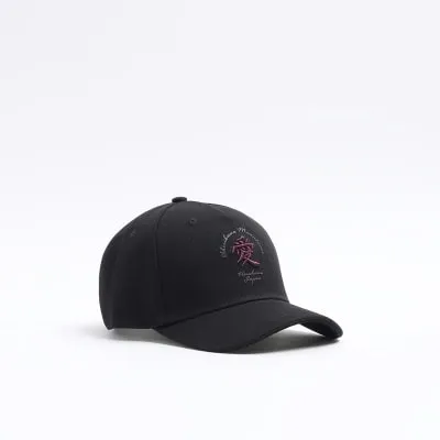 Black canvas Japanese embroidered cap sold by River Island