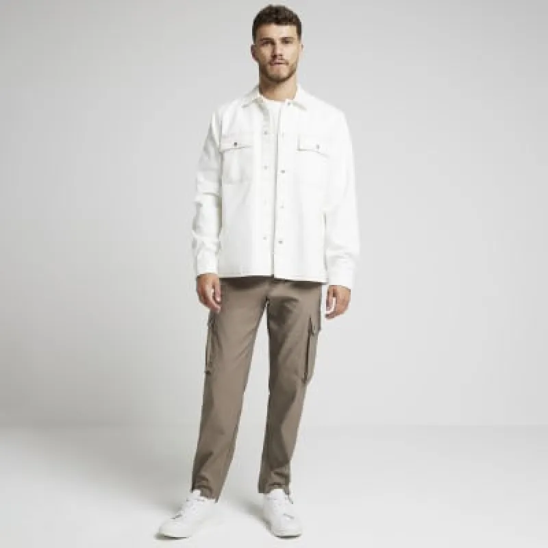 Beige regular fit dropped hem overshirt sold by River Island