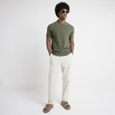 Beige tapered fit pull on trousers sold by River Island