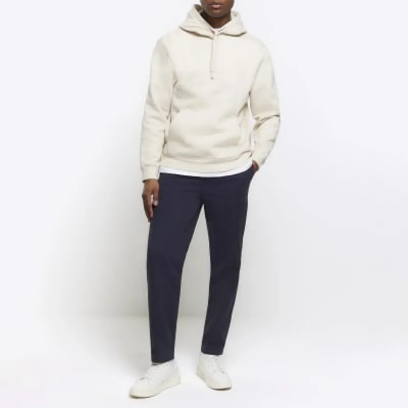 Navy regular fit pull on trousers sold by River Island