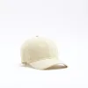 Yellow Seersucker Cap sold by River Island