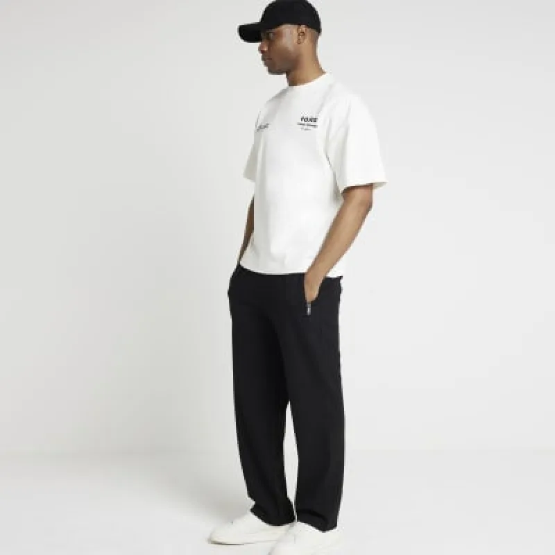 Black regular fit textured open hem joggers sold by River Island