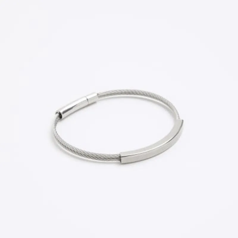 Silver colour bracelet sold by River Island