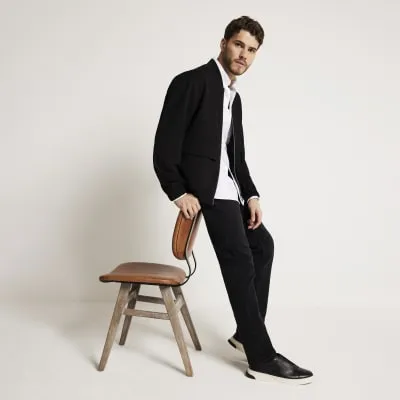 Black regular fit waffle bomber jacket sold by River Island