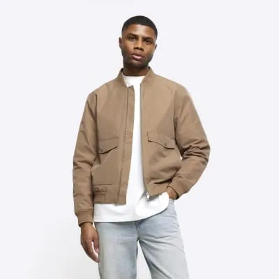 Stone regular fit pocket bomber jacket sold by River Island
